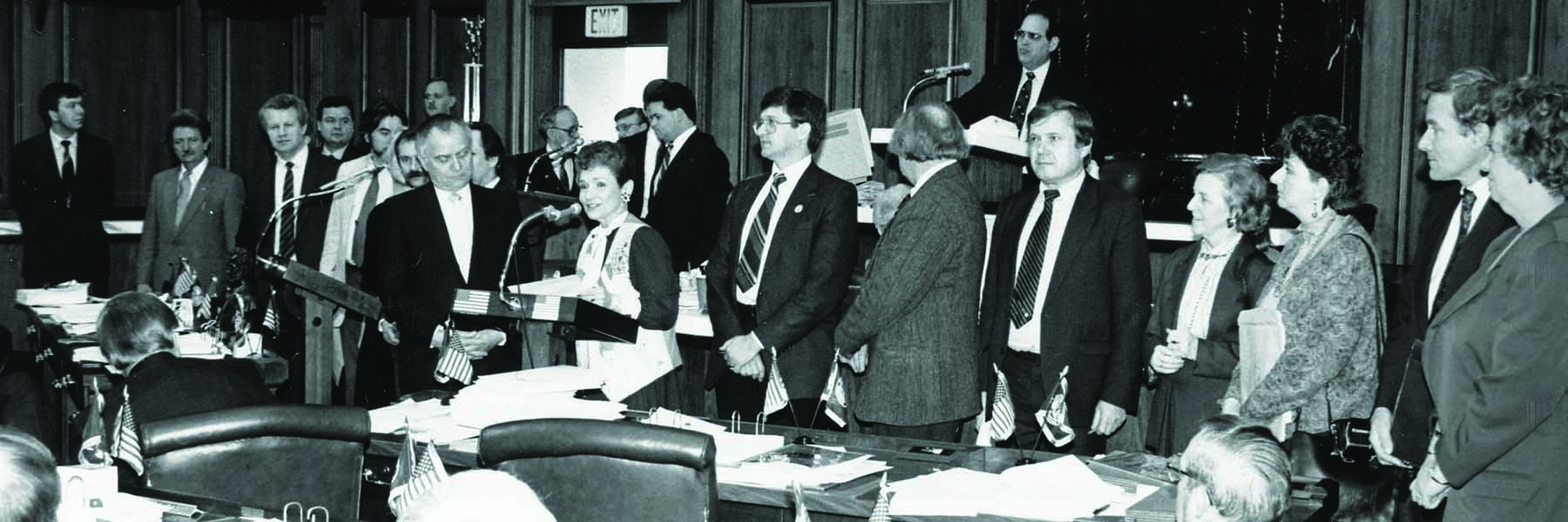 black and white photo of delegates around a table